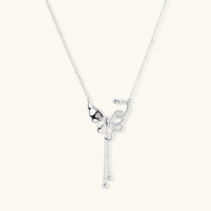 Sterling silver butterfly pendant with textured wing detail on adjustable Y-chain with ball drop ends