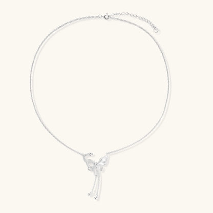 Sterling silver butterfly pendant with textured wing detail on adjustable Y-chain with ball drop ends